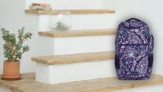backpack made from recycled materials sitting on stairs